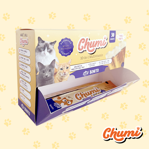 Chumi cat treats packaging on a light yellow background with paw prints